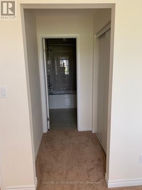 Kitchener townhouse for rent - A hallway with a door at the end.