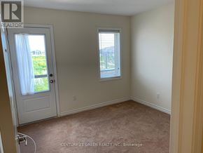 Kitchener townhouse for rent - A room with a carpeted floor and a window with blinds.