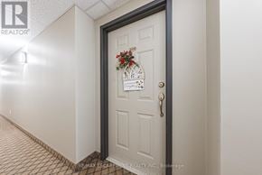 Hamilton (Meadowlands) condo for rent - A hallway with a door at the end.