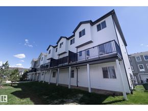 Edmonton townhouse for rent - A row of modern townhouses with balconies and garages.