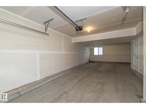 Edmonton townhouse for rent - A room with a white wall and a window on the right side.