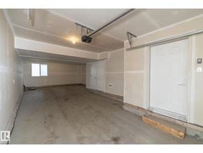 Edmonton townhouse for rent - A room with a white door and a window on the left side.