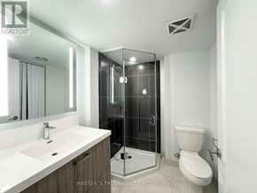 Toronto (Kensington-Chinatown) condo for rent - A bathroom with a sink, toilet and shower.