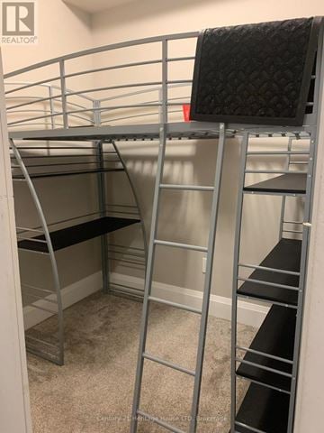 Guelph (St. Patrick's Ward) condo for rent - A metal bunk bed with a black mattress on top.