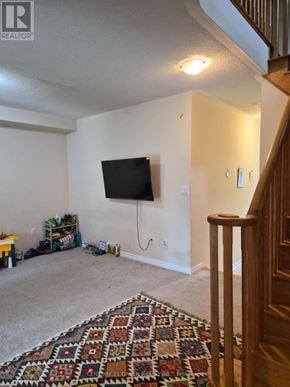 Milton (Be Beaty) apartment for rent - A living room with a flat screen TV mounted on the wall.
