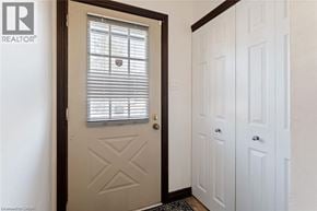 Brantford apartment for rent - A white door with a window above it in a room.