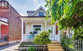 Toronto (Weston-Pellam Park) apartment for rent - A house with a front porch and a white fence.