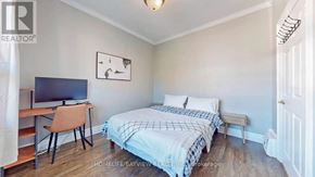 Toronto (Weston-Pellam Park) apartment for rent - A bedroom with a bed, desk, and chair.