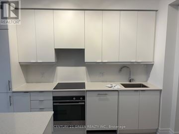 Mississauga (City Centre) condo for rent - A kitchen with white cabinets and a sink.