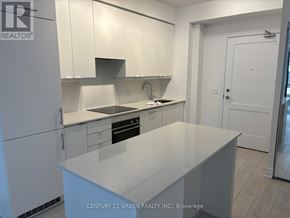 Mississauga (City Centre) condo for rent - A kitchen with white cabinets and a white island.