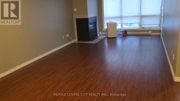 London North (North G) condo for rent - A room with a wooden floor and a television set.