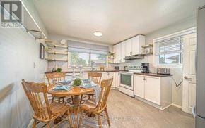 Oshawa (Mclaughlin) apartment for rent - A dining room with a table set for six with a view of the kitchen.
