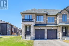 Kawartha Lakes (Lindsay) townhouse for rent - A large house with a balcony and two garages is for sale.
