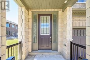 Kawartha Lakes (Lindsay) townhouse for rent - A brown door is on the front of a building.