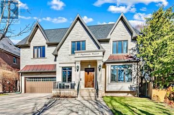 Toronto (Newtonbrook East) apartment for rent - A large, two-story house with a garage and a front porch.