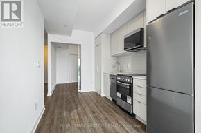 Toronto (West Hill) condo for rent - A modern kitchen with a stainless steel refrigerator and microwave.