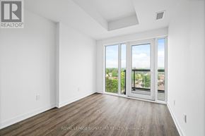 Toronto (West Hill) condo for rent - A white room with a sliding glass door leading to a balcony.