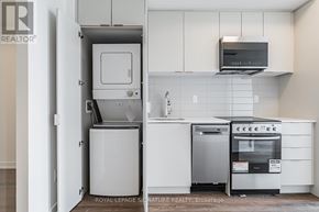 Toronto (West Hill) condo for rent - A white kitchen with a dishwasher and oven.