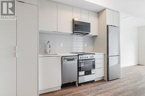 Toronto (West Hill) condo for rent - A kitchen with a stainless steel oven and microwave.
