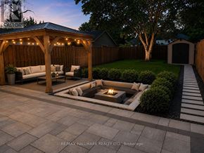 Toronto (Birchcliffe-Cliffside) apartment for rent - A backyard with a fire pit and seating area.