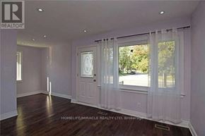 Brampton (Brampton South) apartment for rent - A room with a door and a window with curtains.