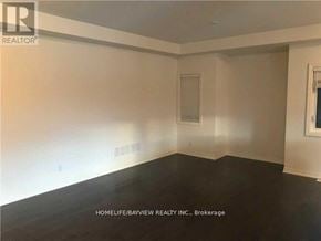 Newmarket (Woodland Hill) apartment for rent - A room with white walls and a window with blinds.