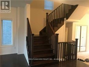 Newmarket (Woodland Hill) apartment for rent - A wooden staircase in a home with a window on the left.