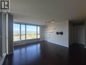 Vancouver apartment for rent - A large empty room with a view of the city through the windows.