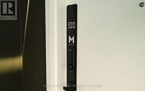 Mississauga (City Centre) condo for rent - A door handle with the number 5310 and the letter M on it.
