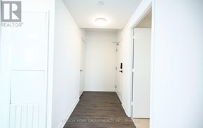 Mississauga (City Centre) condo for rent - A hallway with a door on the left and a door on the right.