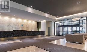 Toronto (Moss Park) condo for rent - A reception area with a marble counter and a brown carpet.
