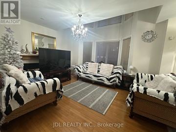 Markham (Wismer) apartment for rent - A living room with a Christmas tree and a television.
