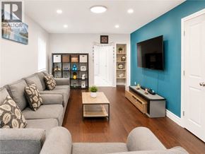 Kitchener apartment for rent - A living room with a grey couch and a wooden coffee table.