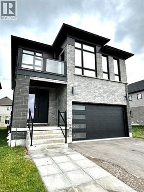 Kitchener apartment for rent - A modern house with a black front door and windows.
