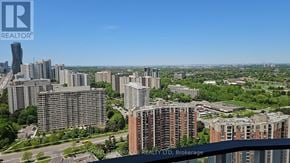 Mississauga (Mississauga Valleys) condo for rent - A cityscape with a clear blue sky and a sign for REALTY LTD, Brokerage.