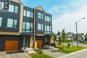 Burlington (Rose) townhouse for rent - A modern two-story building with a black and tan exterior and a glass entrance.