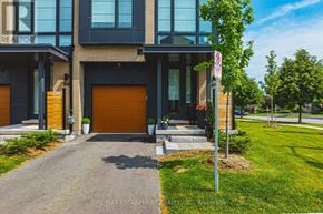 Burlington (Rose) townhouse for rent - A modern house with a glass door and a no parking sign in front.