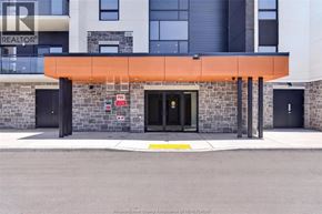 Windsor condo for rent - The front of a building with a black door and a sign that says REALTOR.