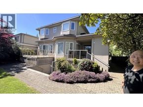 Vancouver apartment for rent - A woman stands in front of a house with a garden.