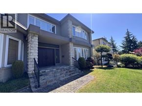 Vancouver apartment for rent - A house with a stone pillar in front of it.