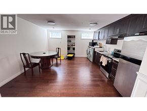Vancouver apartment for rent - A kitchen with a table and chairs in it.