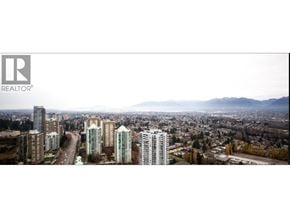 Burnaby apartment for rent - A cityscape with a realtor logo in the corner.