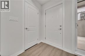 Cambridge townhouse for rent - A white door is in a room with a wooden floor.