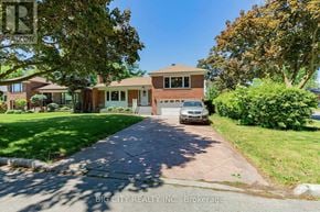 Toronto (Ionview) apartment for rent - A house with a driveway in front of it.