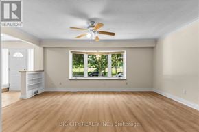 Toronto (Ionview) apartment for rent - A room with a ceiling fan and a window showing greenery outside.