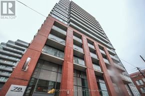 Toronto (Niagara) condo for rent - A tall red brick building with the number 78 on it.