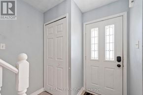 London East (East I) townhouse for rent - A white door with a glass panel and sidelights is on the right.
