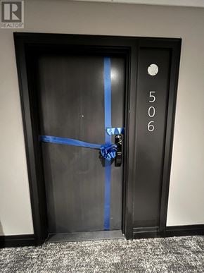 Milton (Walker) condo for rent - A door with a blue ribbon tied around it.