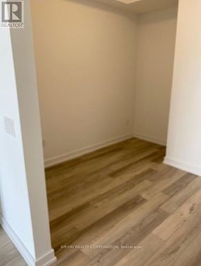 Pickering (Bay Ridges) condo for rent - A room with wood flooring and white walls.
