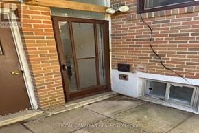 Toronto (West Hill) apartment for rent - A brown door is on the left and a window is on the right.